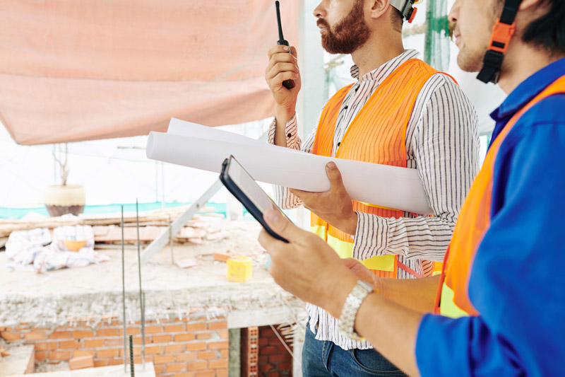 Men holding two way radios