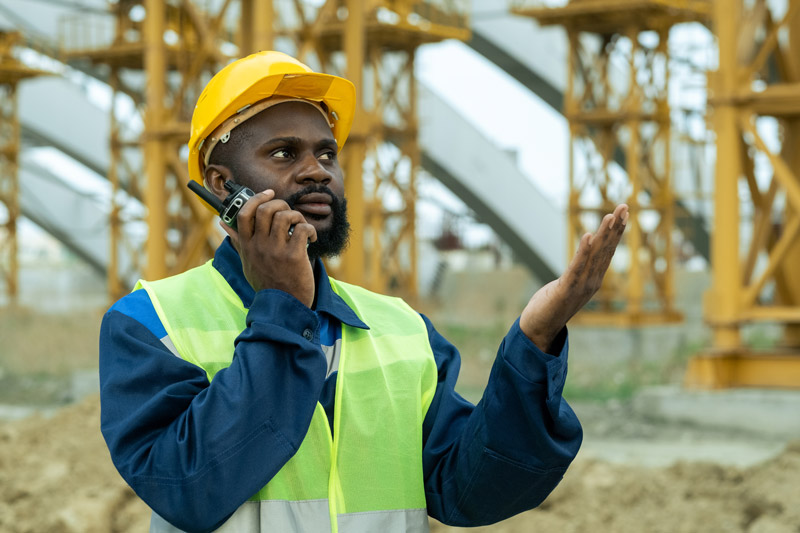 Man Holding POC radio in hand