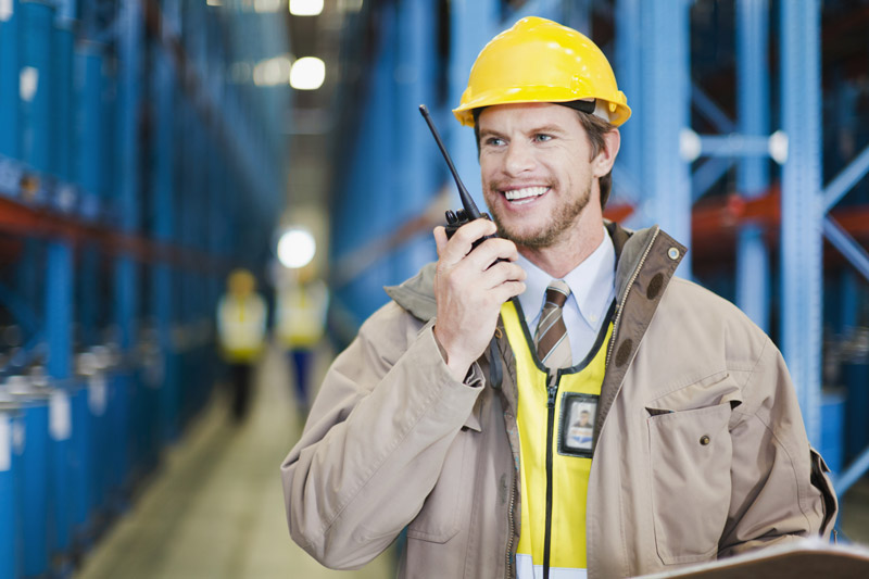 Construction worker holding POC radio